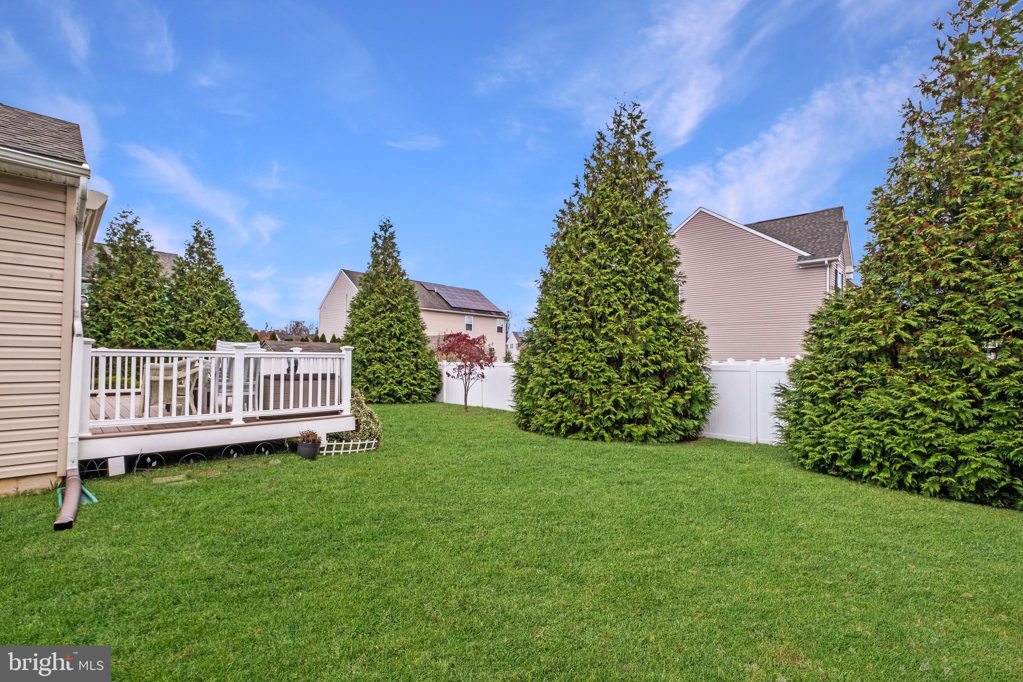 19 Vaughn Way Burlington, NJ 08016 - Photo 41 of 43 a view of a garden with large trees
