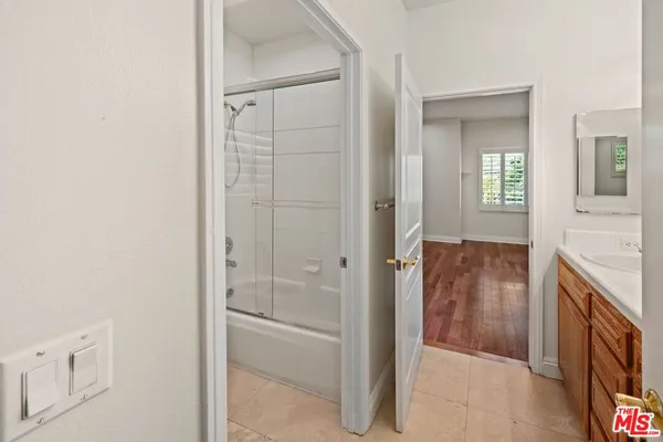 a bathroom with a bathtub and a sink