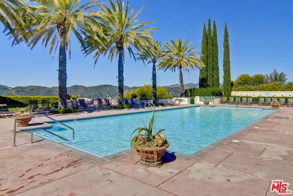 a front view of a garden with swimming pool