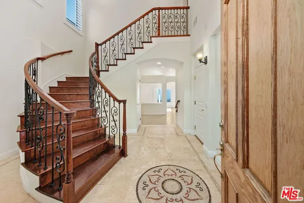 a view of entryway with wooden floor
