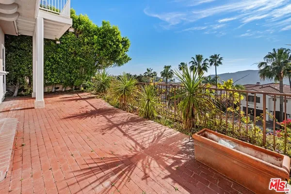 a view of a balcony with an outdoor space