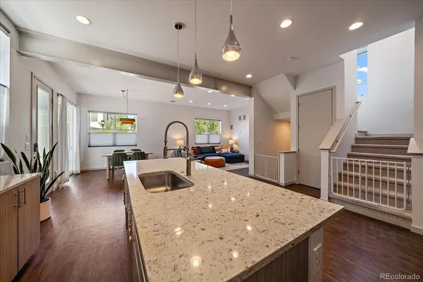 a kitchen with sink and refrigerator