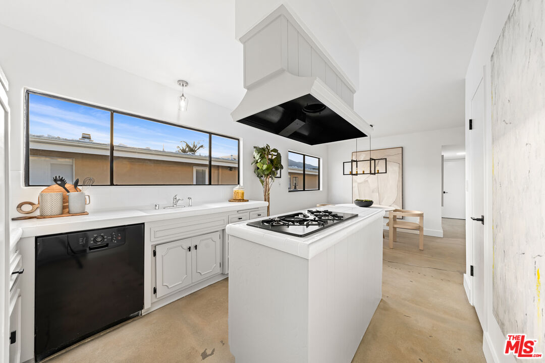 18440 Wakecrest Drive Malibu, CA 90265 - Photo 11 of 29 a kitchen with a stove and a sink