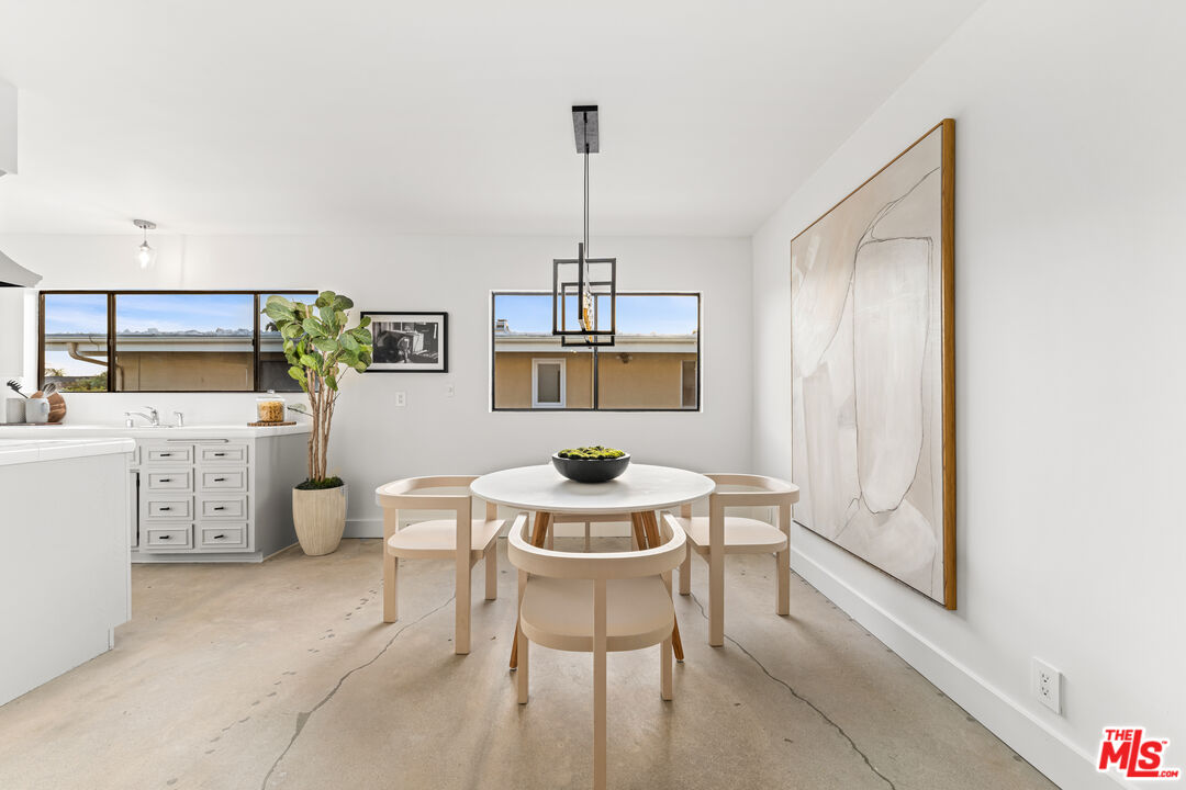 18440 Wakecrest Drive Malibu, CA 90265 - Photo 13 of 29 a dining room with furniture and window