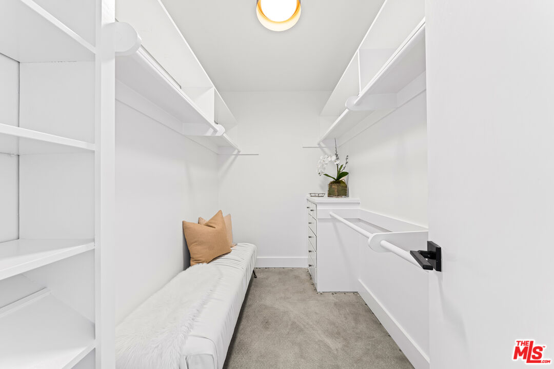 18440 Wakecrest Drive Malibu, CA 90265 - Photo 17 of 29 a living room with furniture and white walls