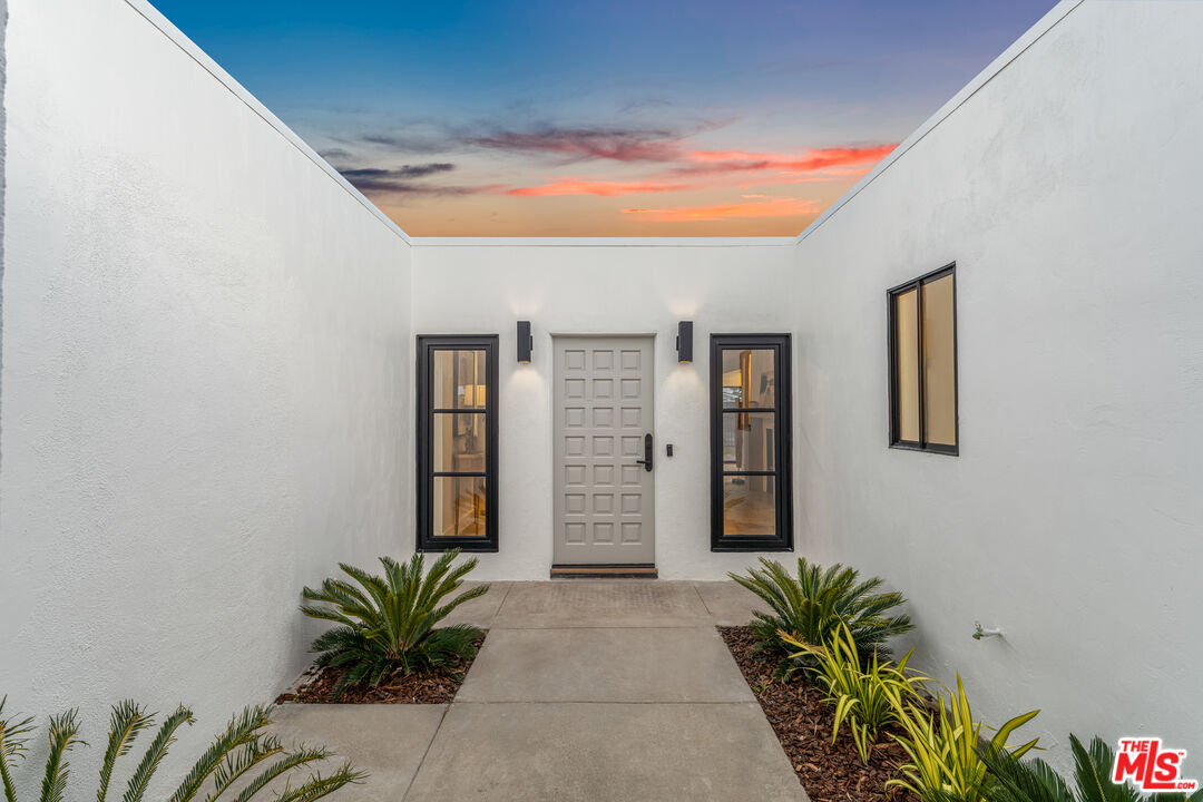 18440 Wakecrest Drive Malibu, CA 90265 - Photo 3 of 29 a view of front door with potted plants