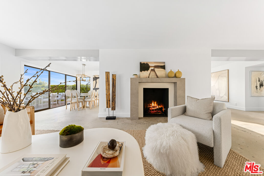 18440 Wakecrest Drive Malibu, CA 90265 - Photo 6 of 29 a living room with furniture and a fireplace