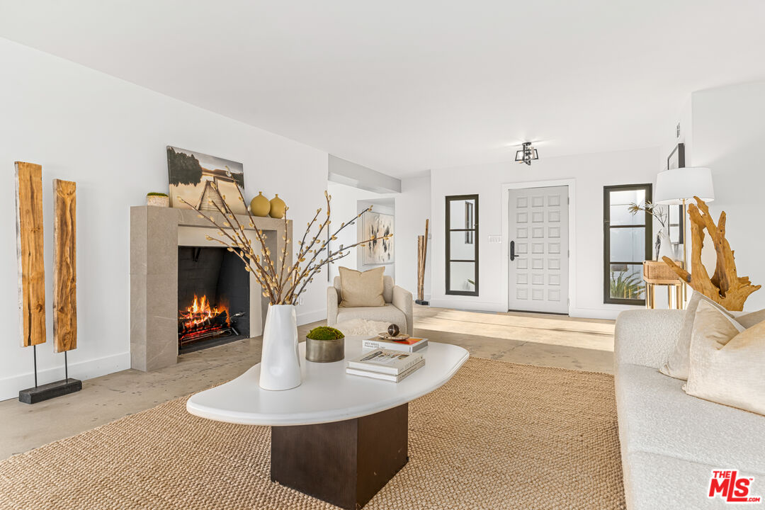18440 Wakecrest Drive Malibu, CA 90265 - Photo 7 of 29 a living room with furniture and a fireplace