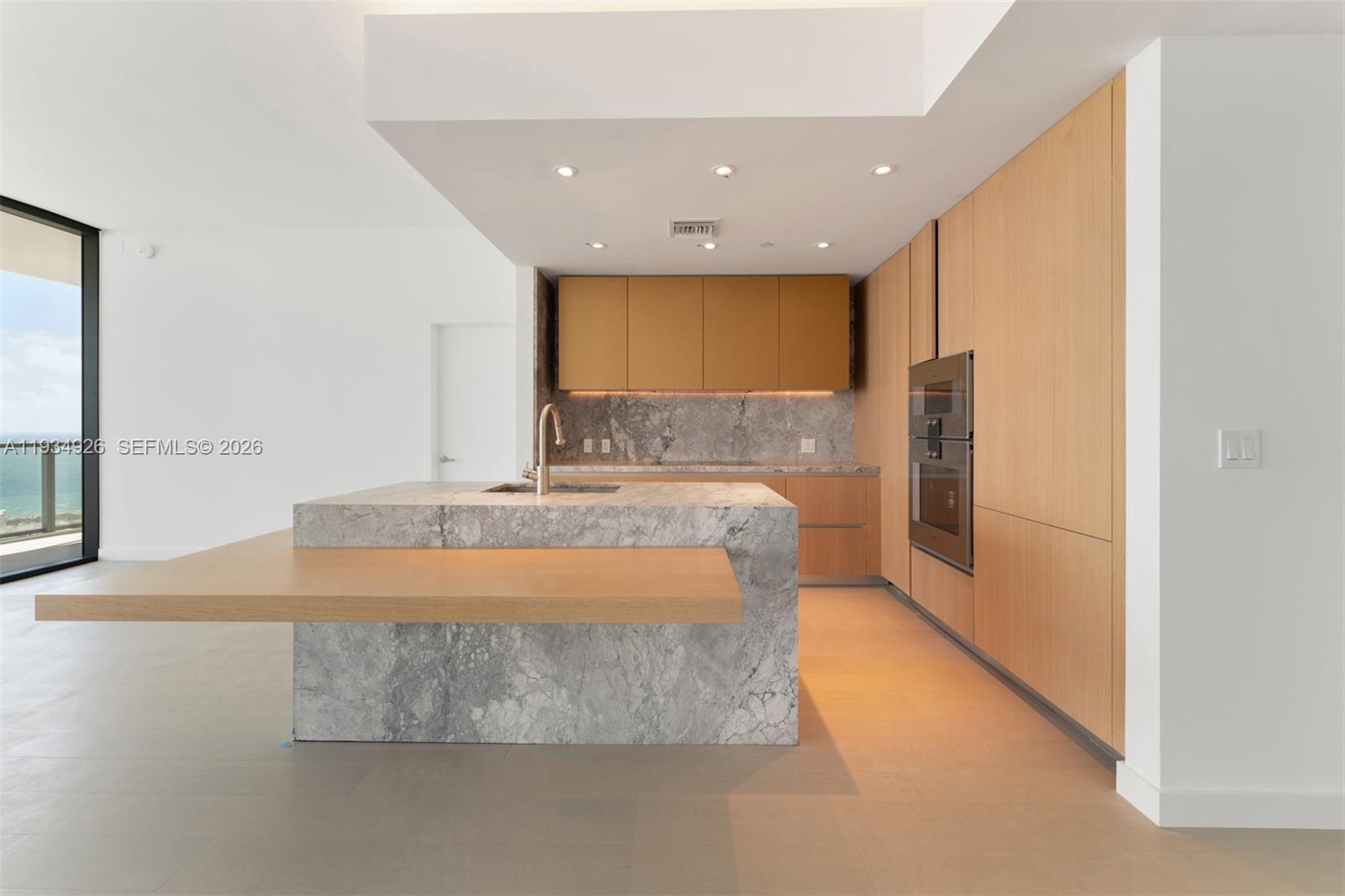 500 Alton Road, Unit 3905 Miami Beach, FL 33139 - Photo 12 of 35 a large room with a large window