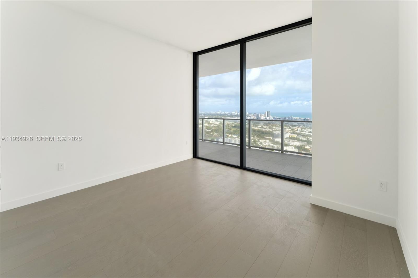 500 Alton Road, Unit 3905 Miami Beach, FL 33139 - Photo 16 of 35 an empty room with windows