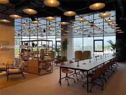 500 Alton Road, Unit 3905 Miami Beach, FL 33139 - Photo 24 of 35 a room with table and chairs