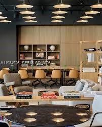 500 Alton Road, Unit 3905 Miami Beach, FL 33139 - Photo 26 of 35 a living room with lots of furniture and clutter