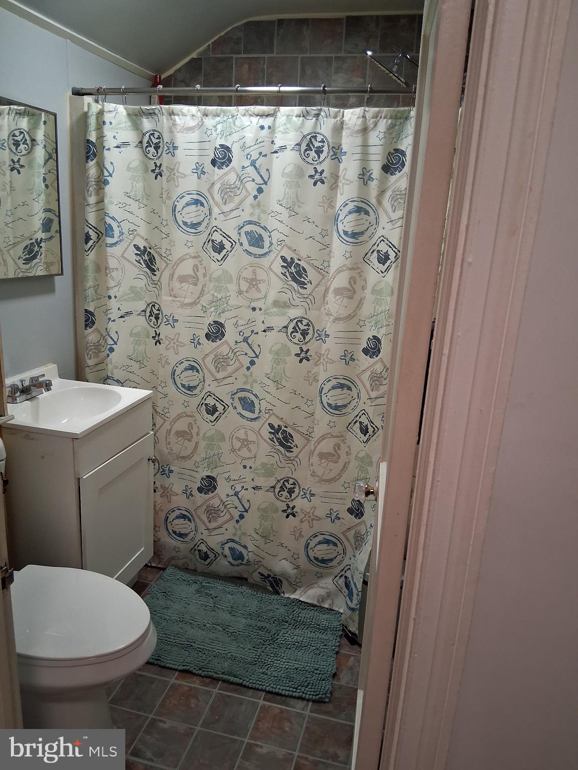 117 Stahl Avenue New Castle, DE 19720 - Photo 13 of 20 a bathroom with a toilet and a shower curtain