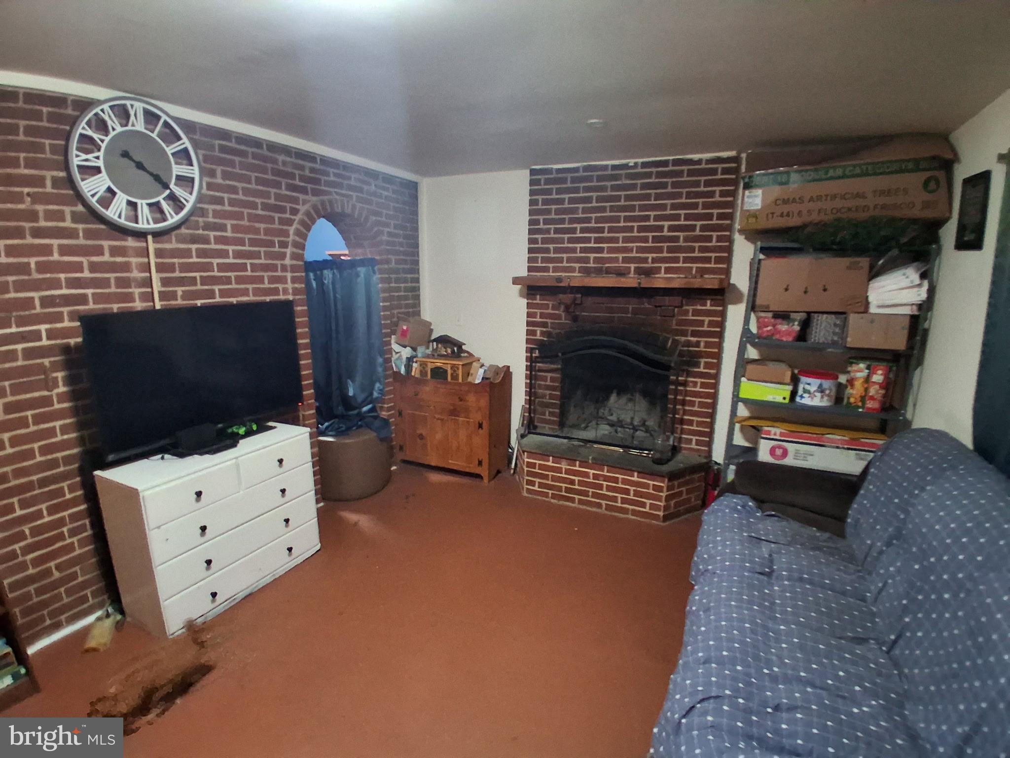 117 Stahl Avenue New Castle, DE 19720 - Photo 14 of 20 a living room with furniture a flat screen tv and a fireplace