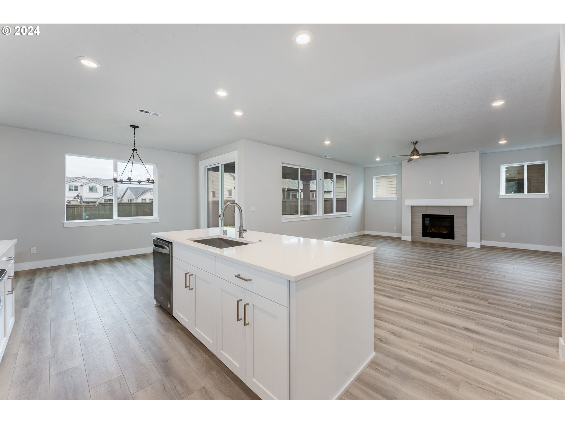 3610 South 44th Avenue Ridgefield, WA 98642 - Photo 11 of 38 a kitchen with a sink cabinets and wooden floor