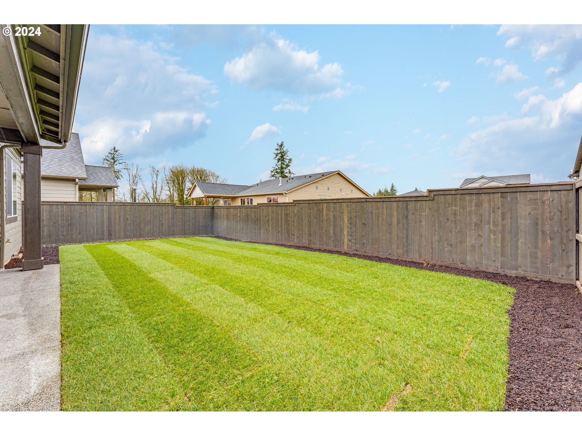 3610 South 44th Avenue Ridgefield, WA 98642 - Photo 33 of 38 a swimming pool with wooden fence
