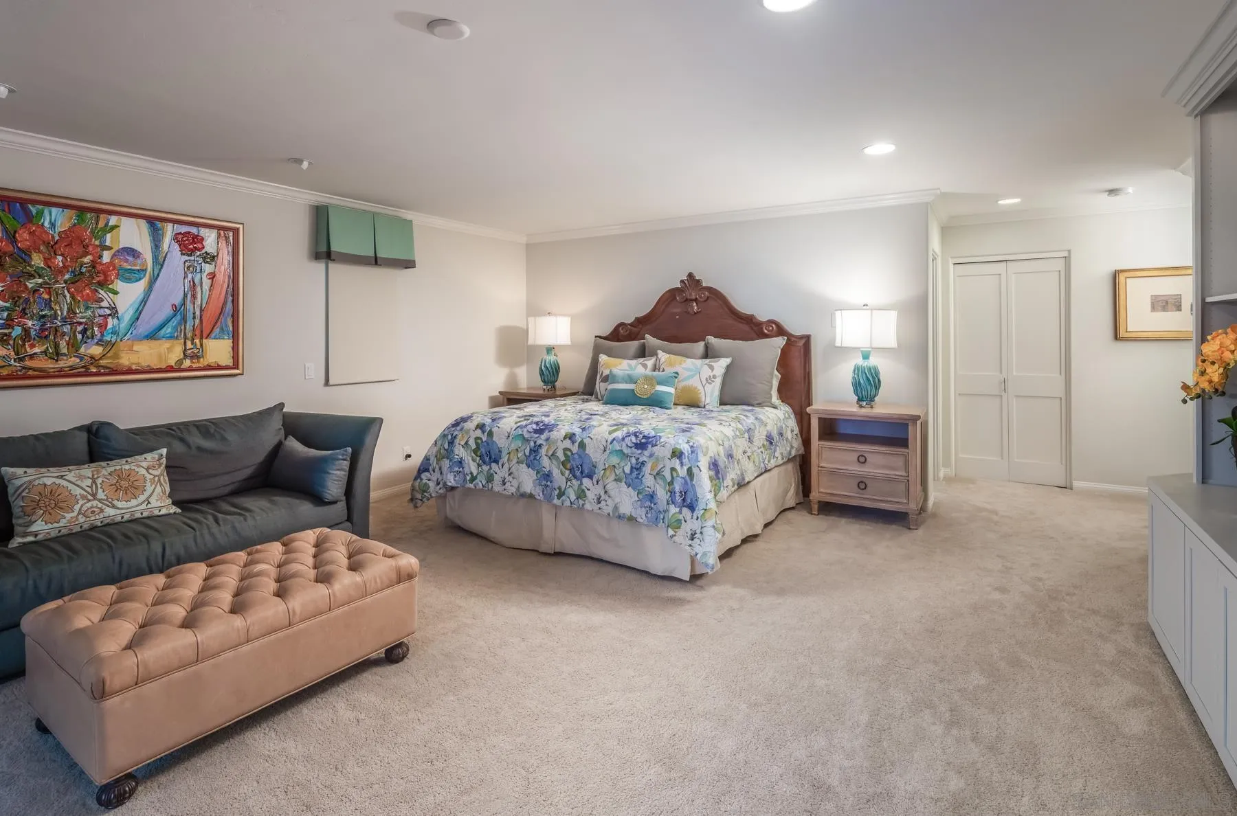 258 Neptune Avenue Encinitas, CA 92024 - Photo 17 of 26 a spacious bedroom with a bed and a couch