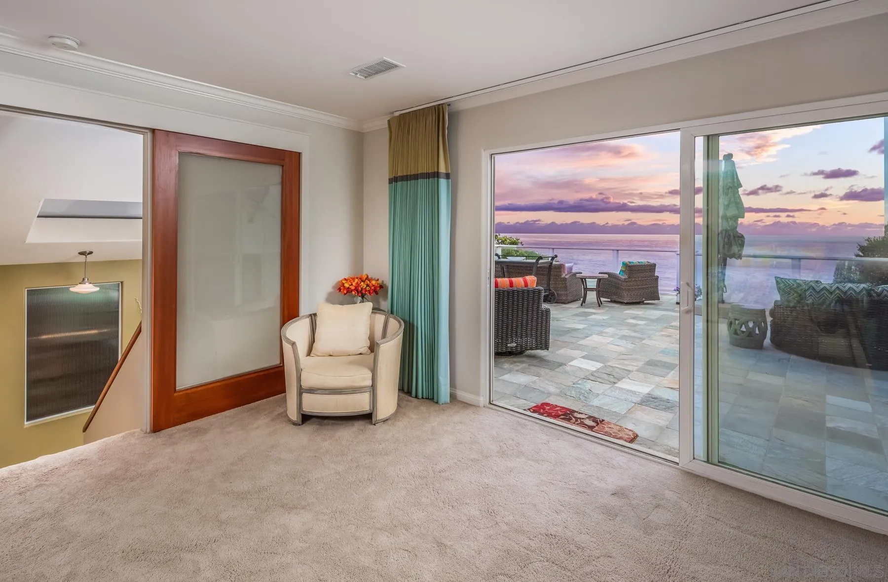 258 Neptune Avenue Encinitas, CA 92024 - Photo 18 of 26 a living room with furniture and a floor to ceiling window
