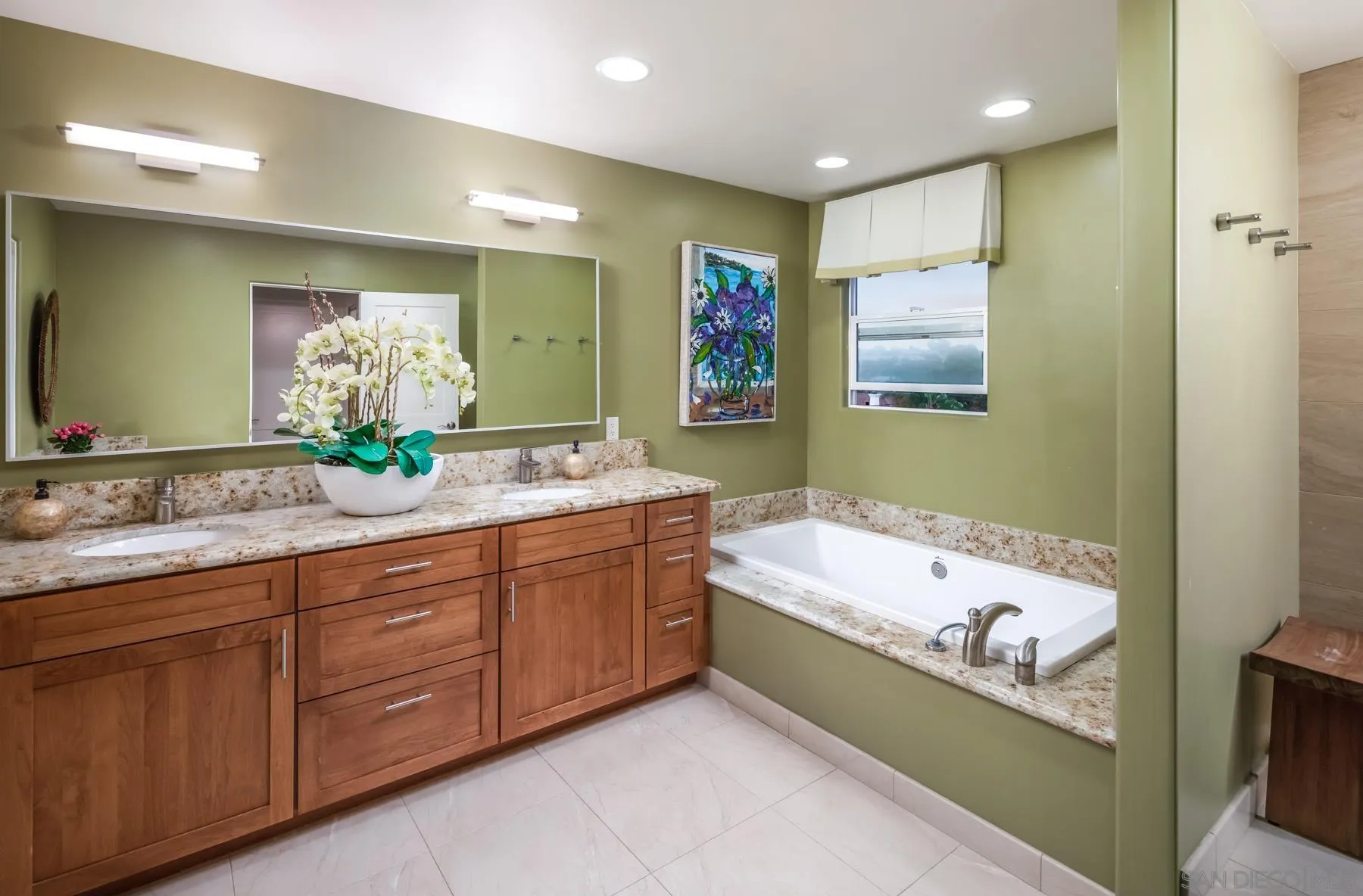 258 Neptune Avenue Encinitas, CA 92024 - Photo 20 of 26 a bathroom with a bathtub sink and mirror
