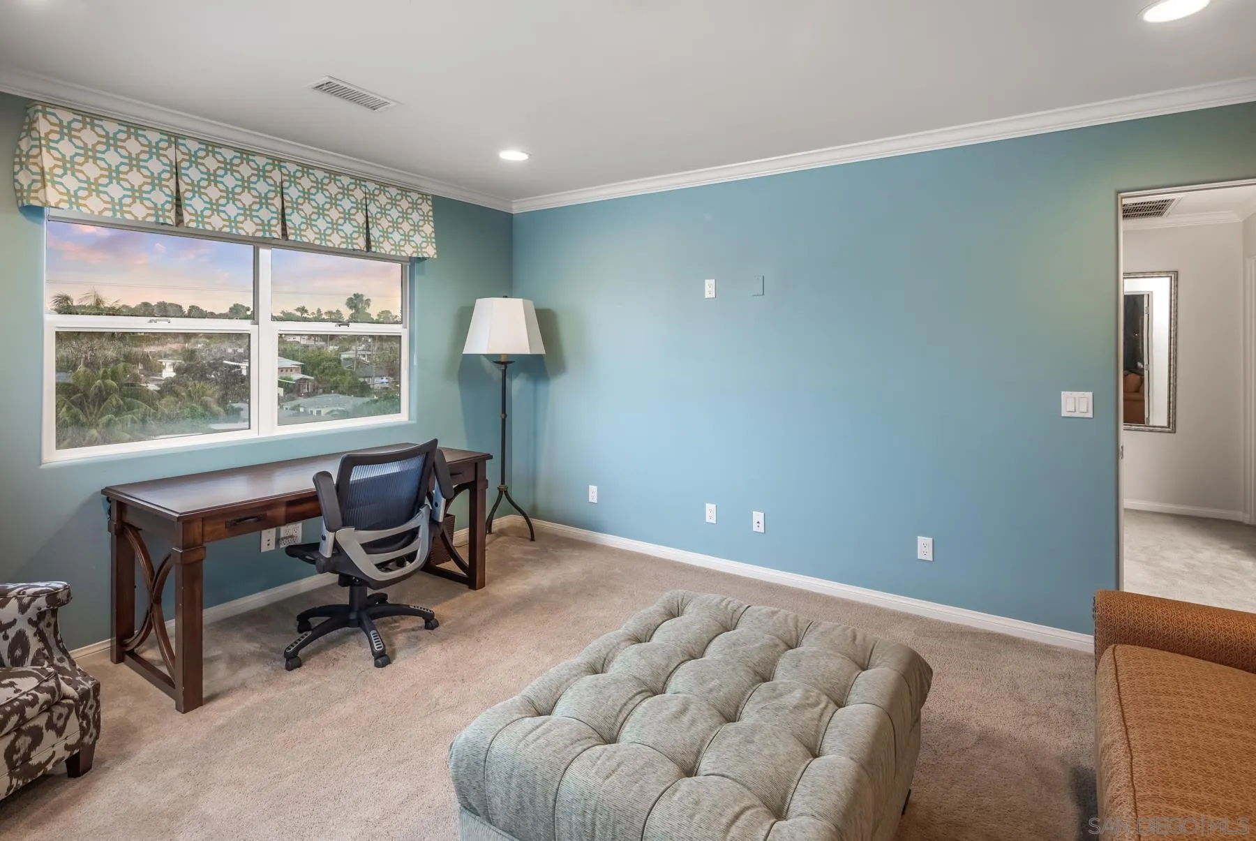 258 Neptune Avenue Encinitas, CA 92024 - Photo 22 of 26 a workspace with furniture and a large window