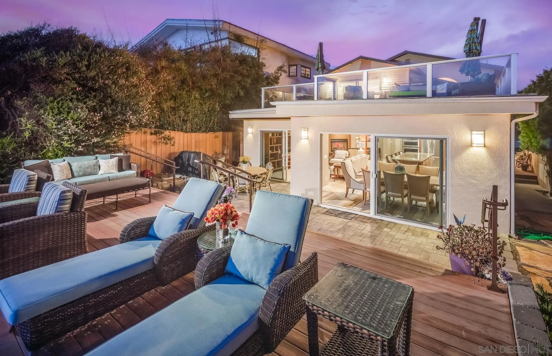 258 Neptune Avenue Encinitas, CA 92024 - Photo 24 of 26 a view of a patio with couches table and chairs and potted plants