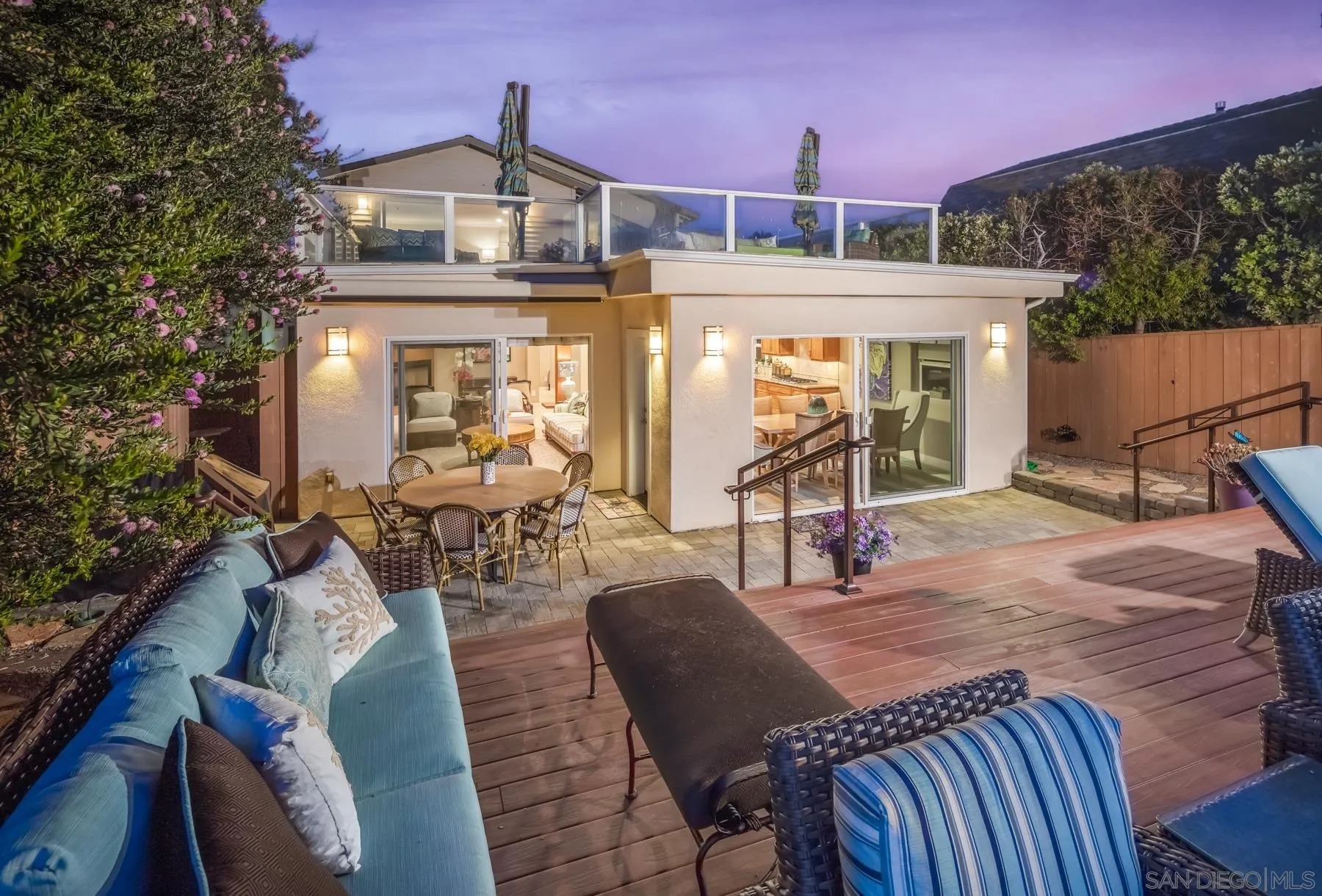 258 Neptune Avenue Encinitas, CA 92024 - Photo 25 of 26 a view of a patio with table and chairs a barbeque with wooden floor and roof