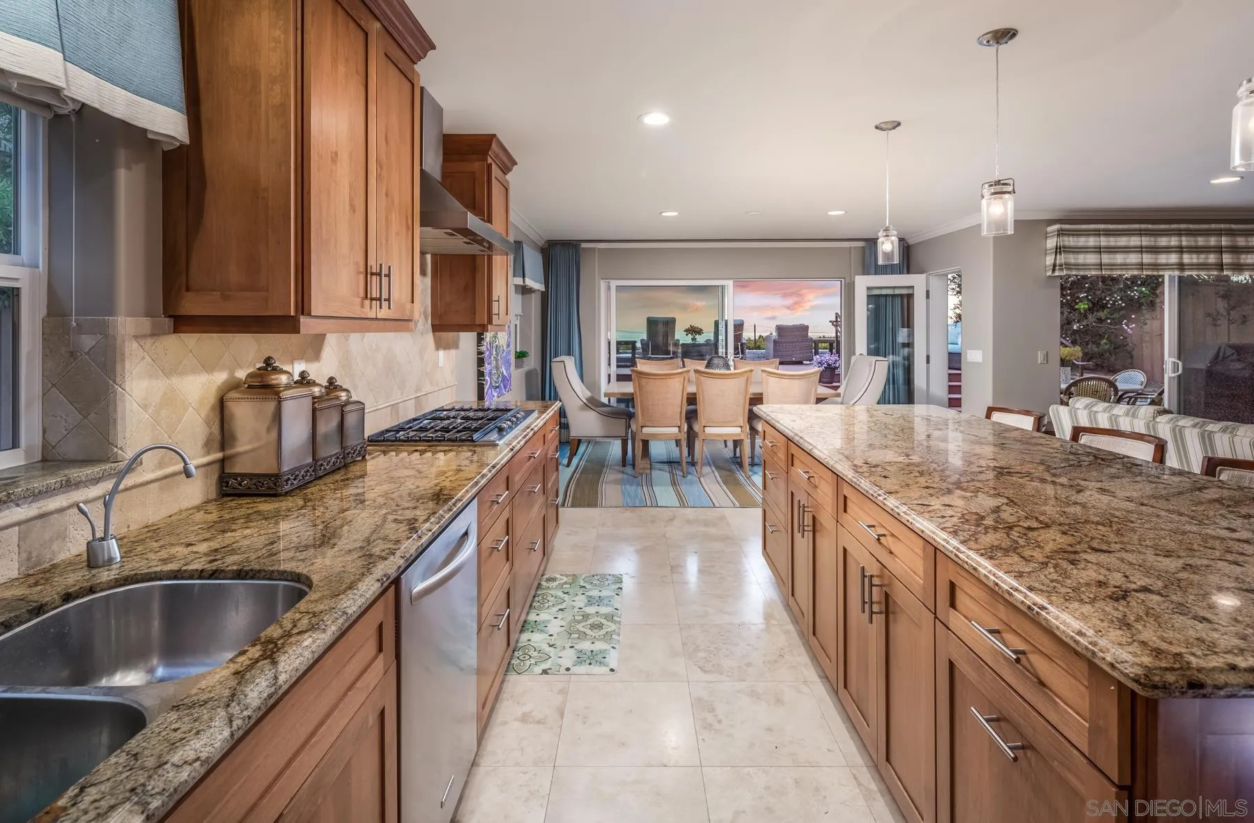 258 Neptune Avenue Encinitas, CA 92024 - Photo 7 of 26 a kitchen with stainless steel appliances granite countertop a sink stove and cabinets