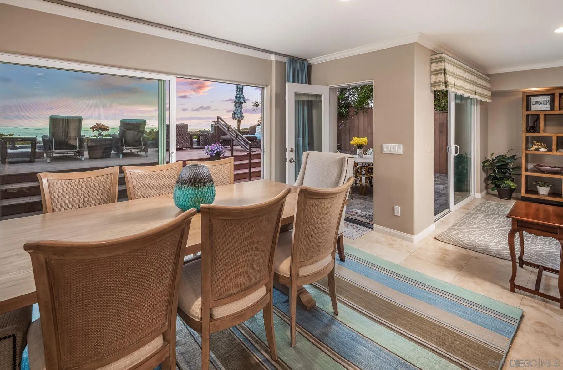 258 Neptune Avenue Encinitas, CA 92024 - Photo 10 of 26 a view of a dining room with furniture window and outside view