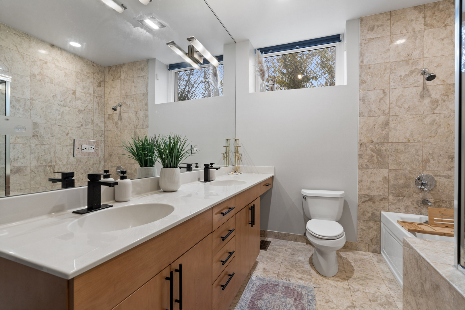 2828 North Talman Avenue, Unit R Chicago, IL 60618 - Photo 11 of 31 a bathroom with a toilet sink double vanity and mirror