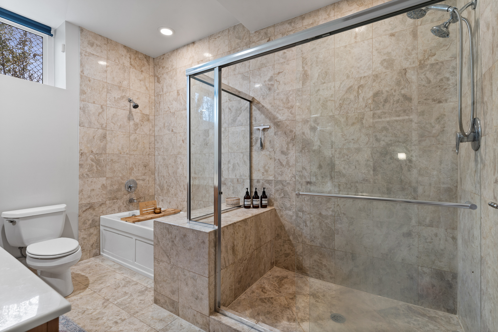 2828 North Talman Avenue, Unit R Chicago, IL 60618 - Photo 12 of 31 a bathroom with a granite countertop sink a toilet and shower