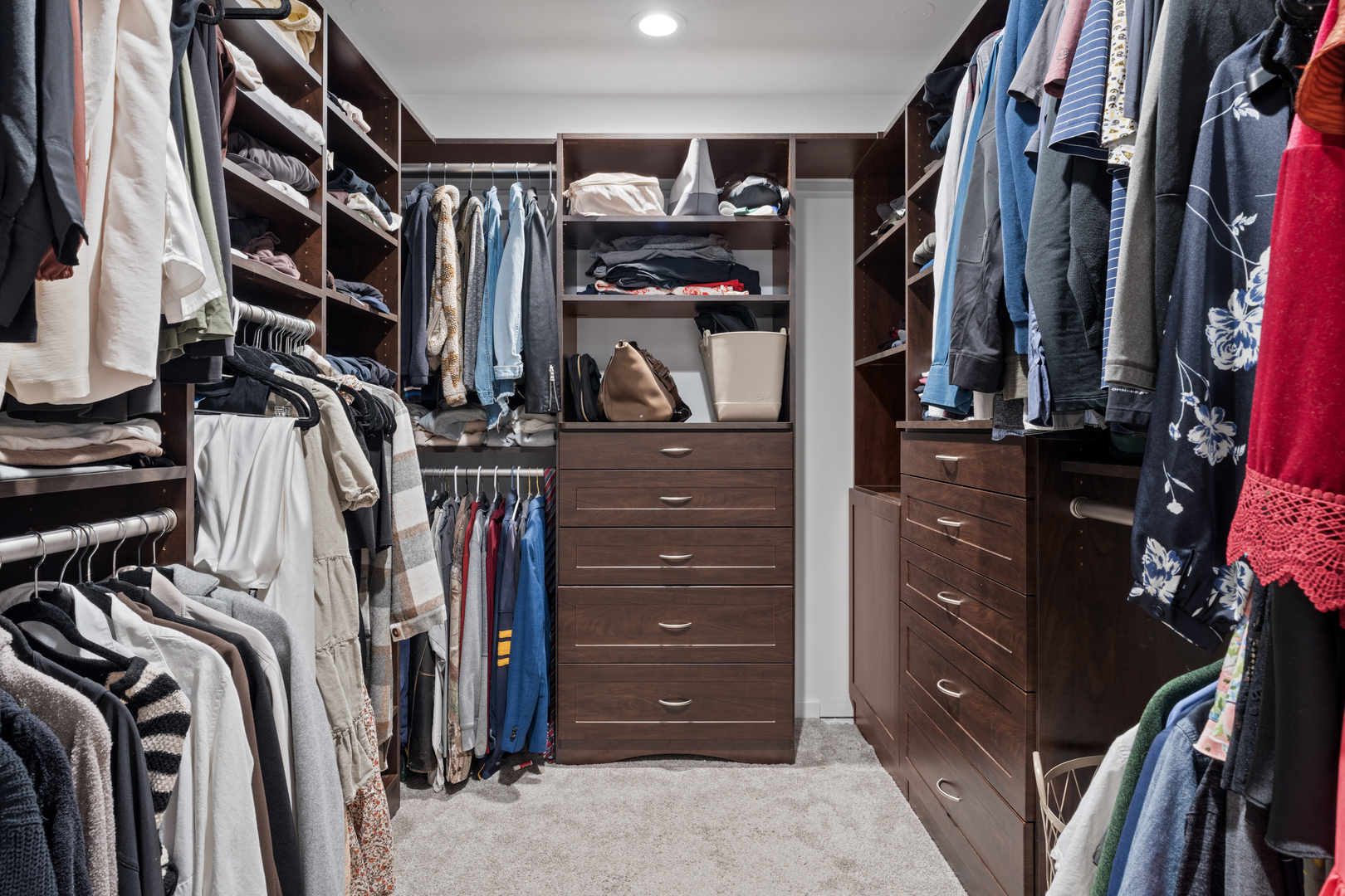 2828 North Talman Avenue, Unit R Chicago, IL 60618 - Photo 13 of 31 a view of walk in closet with clothes and shoes