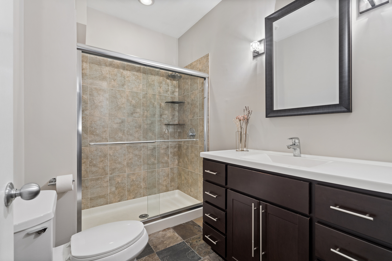 2828 North Talman Avenue, Unit R Chicago, IL 60618 - Photo 20 of 31 a bathroom with a sink toilet a mirror and shower