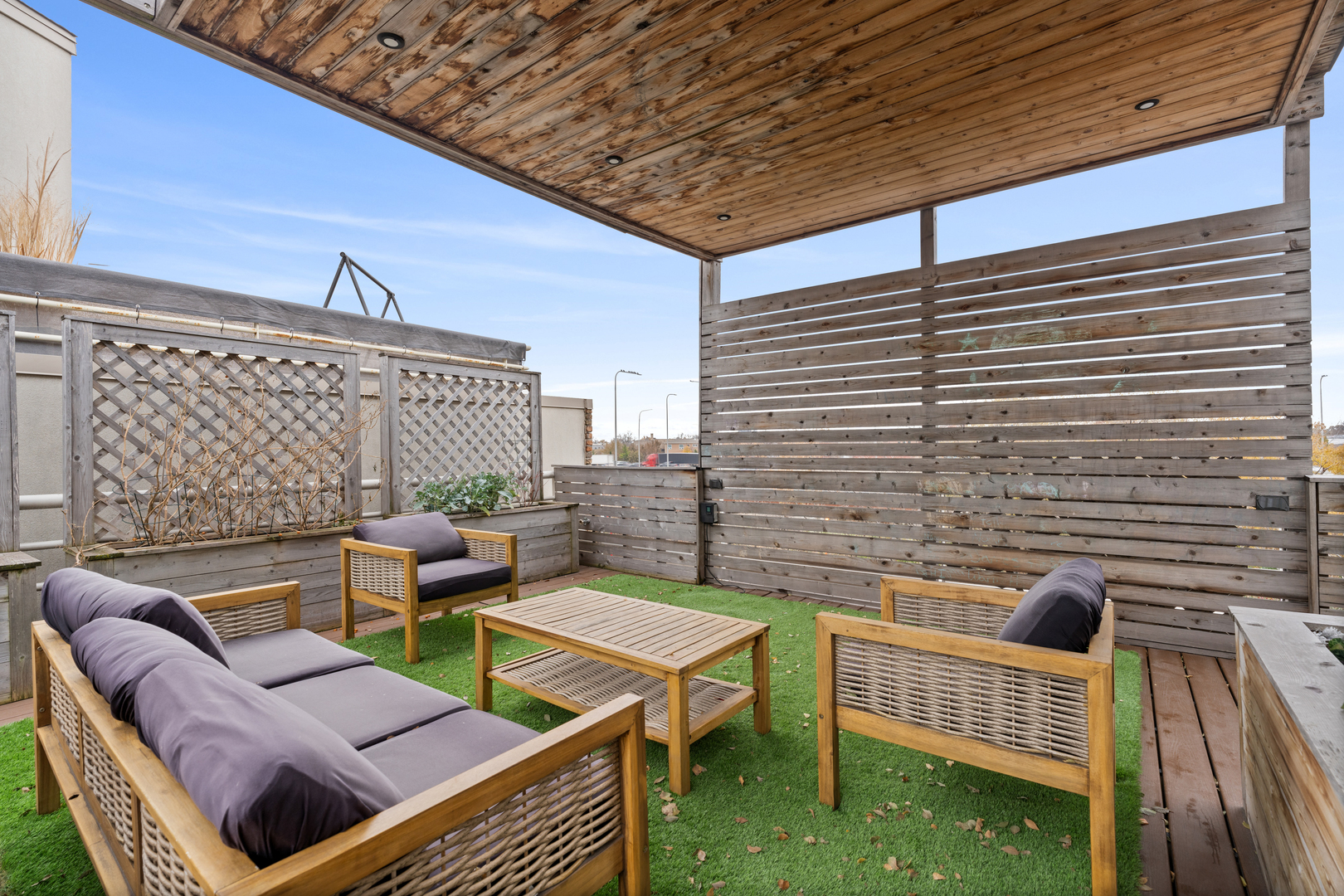 2828 North Talman Avenue, Unit R Chicago, IL 60618 - Photo 25 of 31 a roof deck with a couch and chairs