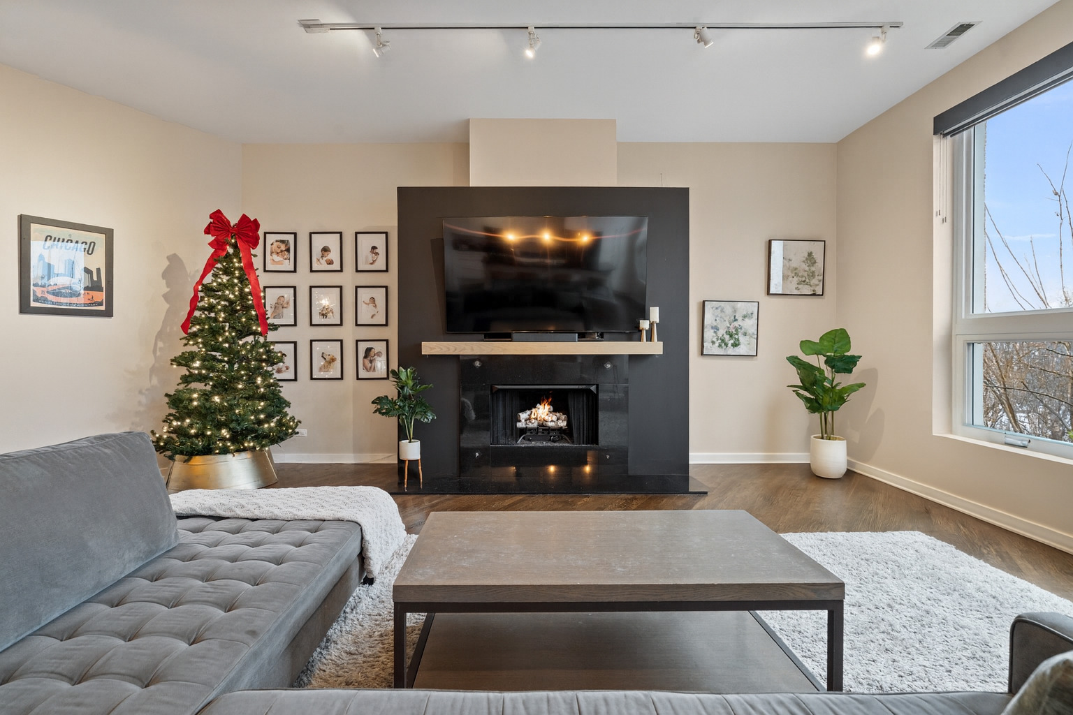 2828 North Talman Avenue, Unit R Chicago, IL 60618 - Photo 4 of 31 a living room with furniture a flat screen tv and a fireplace