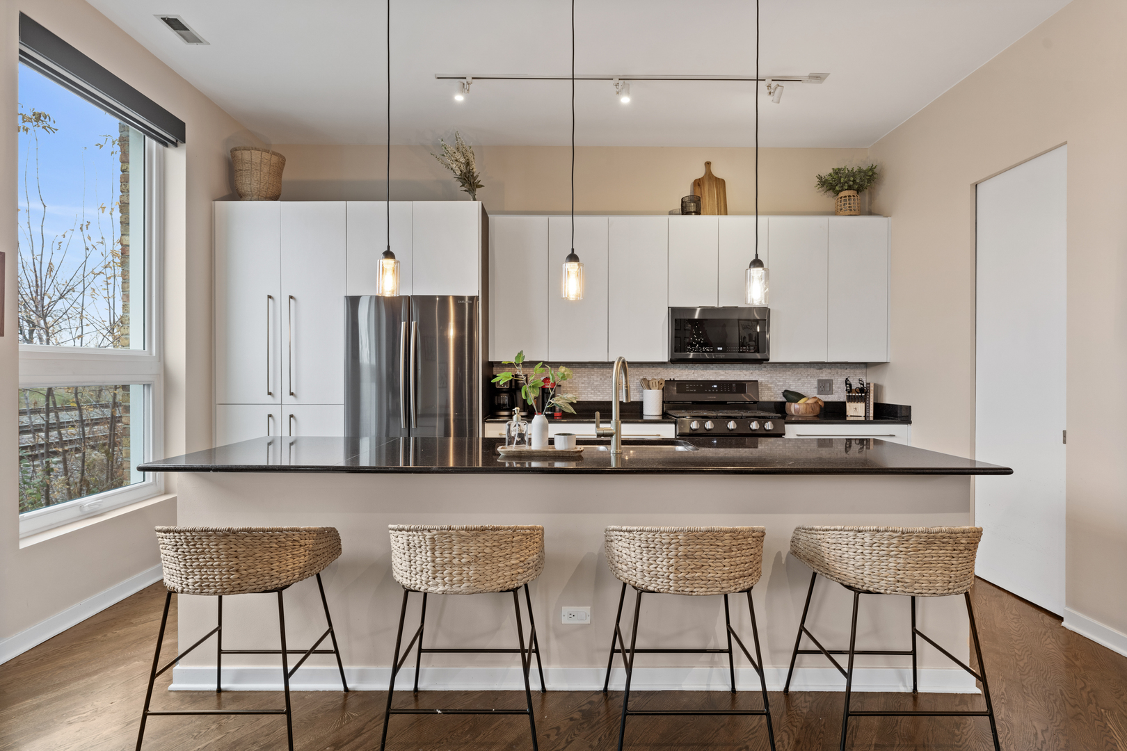 2828 North Talman Avenue, Unit R Chicago, IL 60618 - Photo 8 of 31 a kitchen with stainless steel appliances granite countertop a stove a sink and a refrigerator