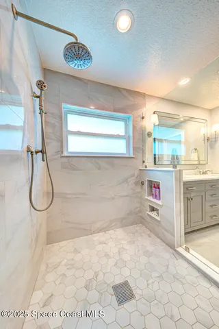 a spacious bathroom with a double vanity sink mirror and toilet