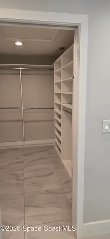 a bathroom with a granite countertop sink mirror vanity and toilet