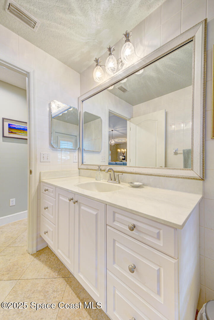 3950 Postridge Trail Melbourne, FL 32934 - Photo 36 of 63 Half Bath Leading to Pool View 1