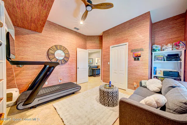 a view of a swimming pool with a patio and a yard