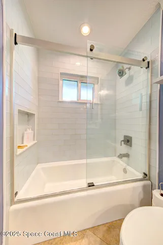 a view of living room and wooden floor