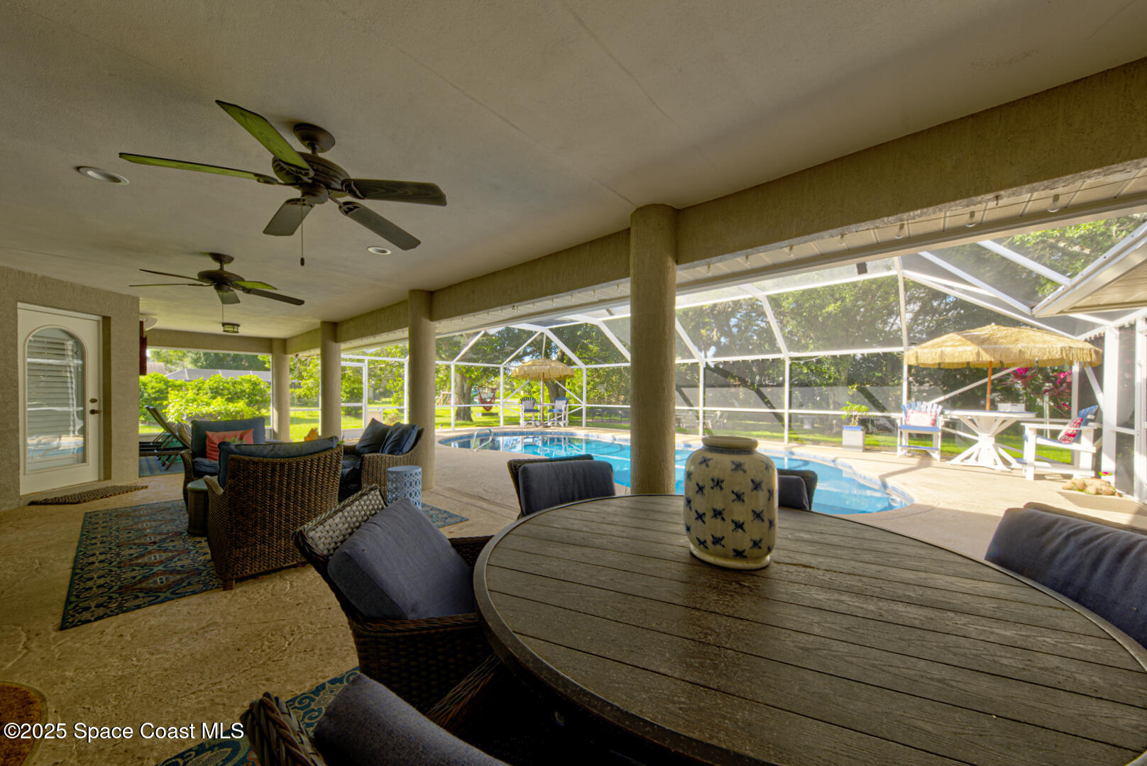 3950 Postridge Trail Melbourne, FL 32934 - Photo 50 of 63 Lanai & Shimmering salt water pool