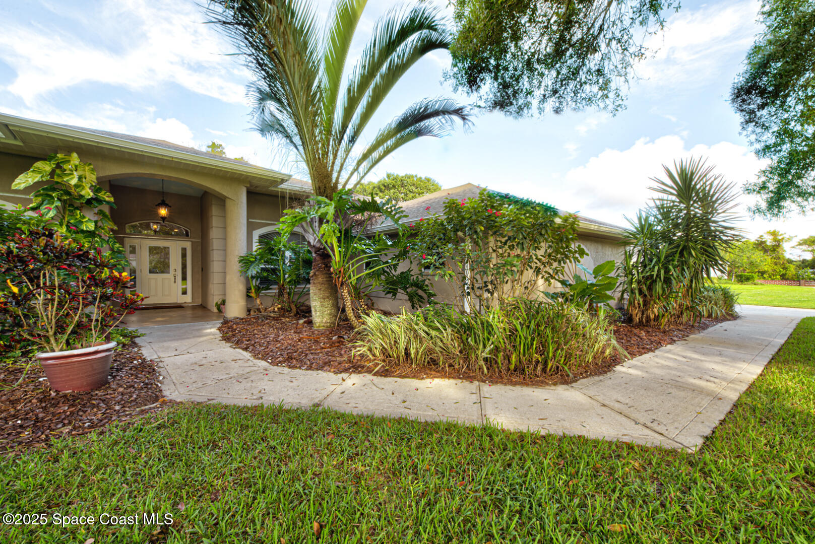3950 Postridge Trail Melbourne, FL 32934 - Photo 54 of 63 Walk way to Front Door