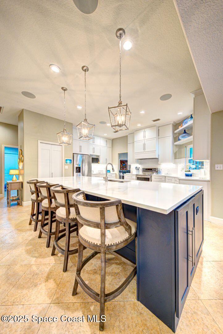 3950 Postridge Trail Melbourne, FL 32934 - Photo 8 of 63 Breakfast Bar with Generous Seating