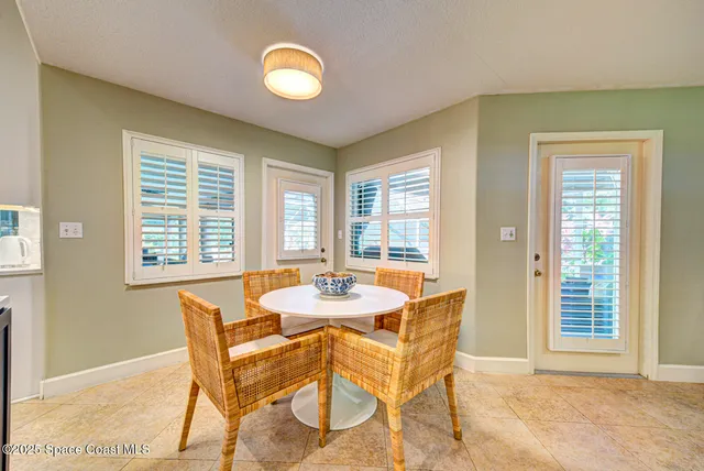 a living room with furniture window and wooden floor