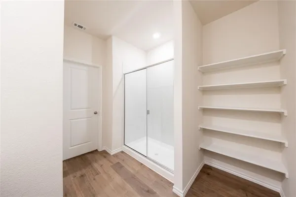a view of an empty walk in closet