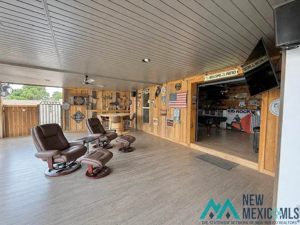 5404 Sioux Road Carlsbad, NM 88220 - Photo 62 of 100 Expansive covered patio featuring a slatted ceiling, recessed lighting, and ceiling fans