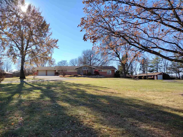a view of yard with swimming pool