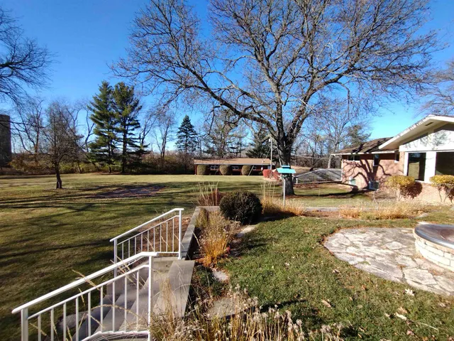 a view of a hall with wooden floor