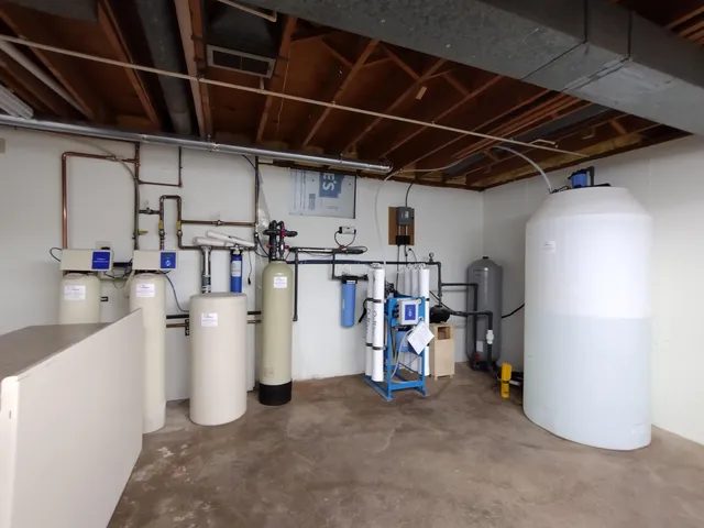 an empty room with a projector and closet