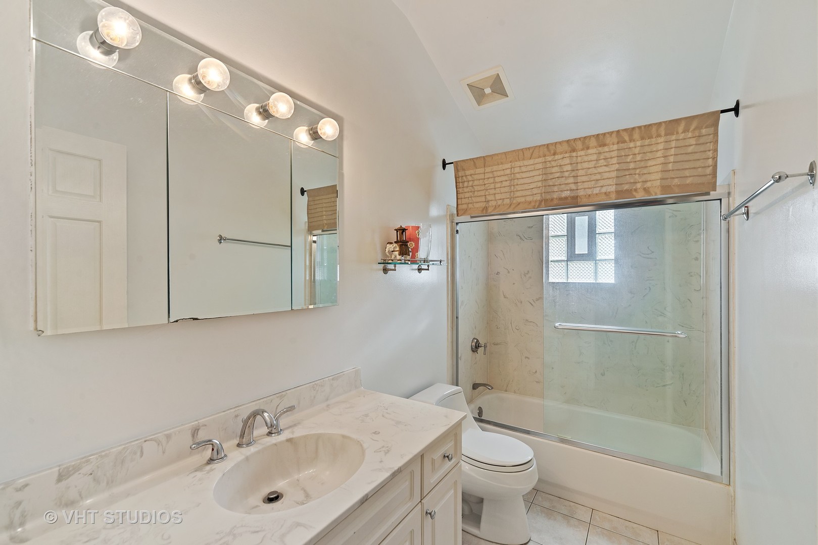 197 West Butterfield Road Elmhurst, IL 60126 - Photo 11 of 15 a bathroom with a sink a toilet and shower
